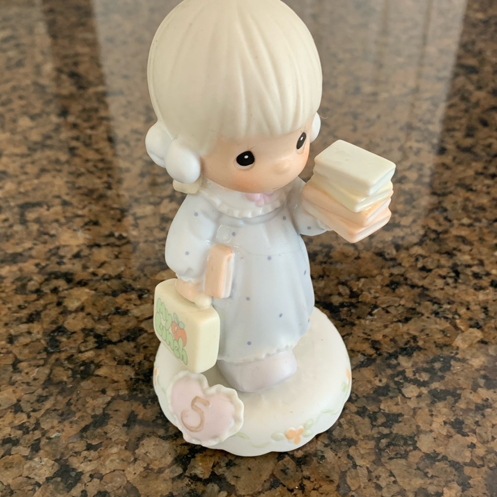 Precious moments “growing in grace,age 5” figurine.